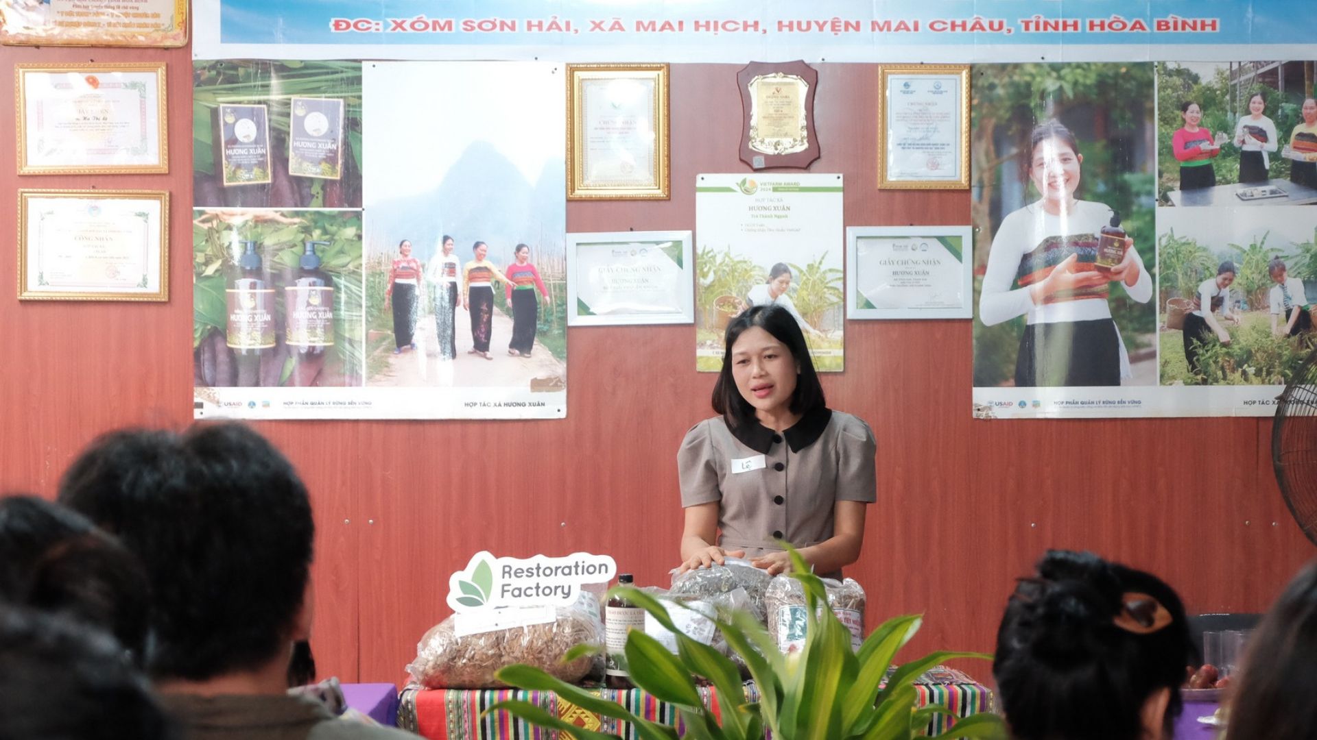 Forest Ecopreneurs participants networking at an exhibition booth.